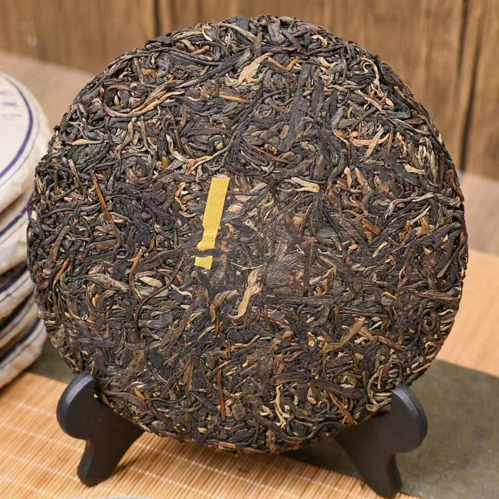 compressed golden bud pu-erh tea cake close up