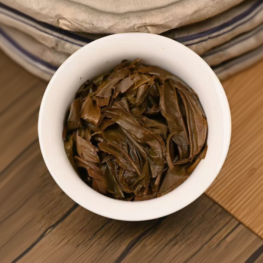 loose leaves from aged Mengku raw pu-erh tea